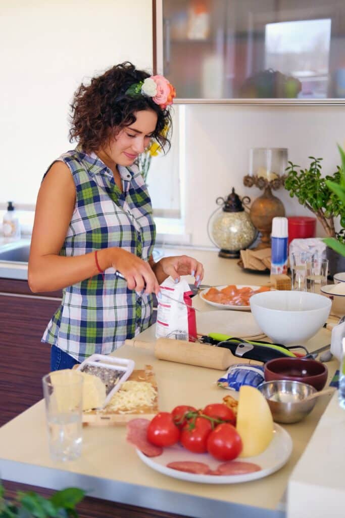 About me 1 positive brunette female makes dough in a kitchen 2025 01 25 14 58 20 utc min