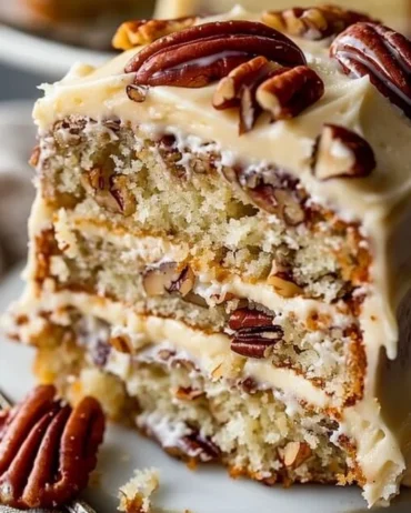 Butter Pecan Cake Layers 5 Delicious layers of butter pecan cake showcasing rich flavors and crunchy pecans.