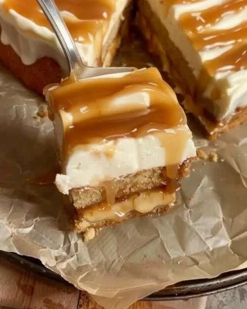 Caramel Apple Cake 2 Delicious caramel apple cake served on a plate with caramel drizzle.