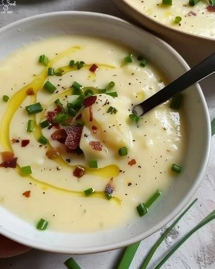 Creamy Potato Leek Soup garnished with fresh herbs