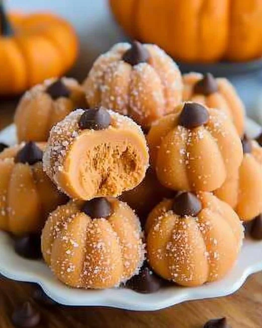 Delicious Pumpkin Cheesecake Truffles served on a decorative plate