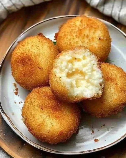 Cheese Croquettes 2 Delicious cheese croquettes served on a plate with dipping sauce