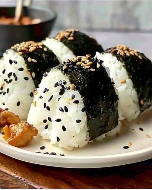 Delicious Chicken Rice Balls served with fresh herbs and dipping sauce.